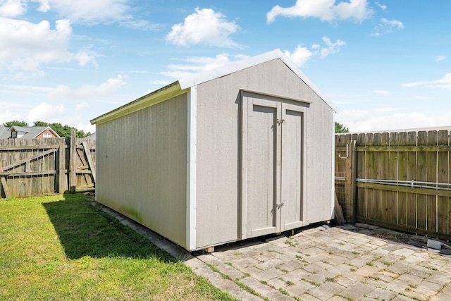 view of shed with a fenced backyard