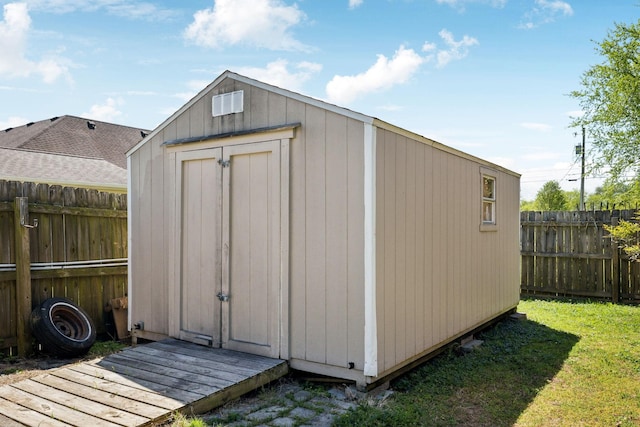 view of shed featuring a fenced backyard