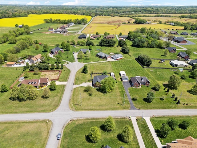 birds eye view of property with a rural view