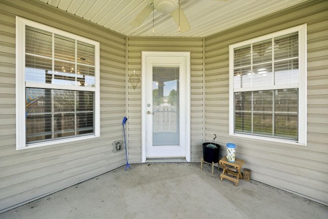 doorway to property featuring a patio and ceiling fan