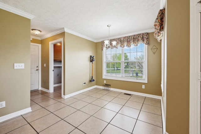 unfurnished dining area with a chandelier, visible vents, light tile patterned floors, and a textured ceiling