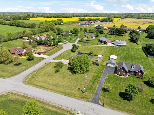 birds eye view of property with a rural view
