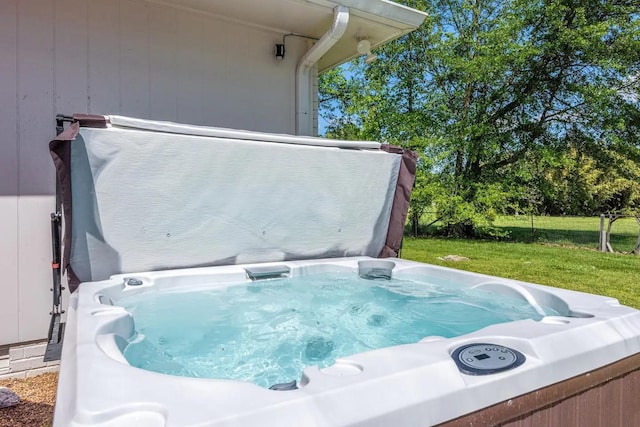 exterior details featuring a hot tub