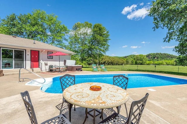 view of pool with a fenced in pool, a patio area, a jacuzzi, and fence