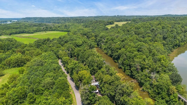 aerial view featuring a water view and a view of trees