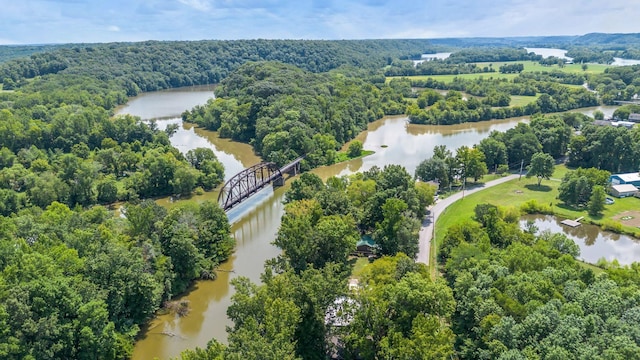 aerial view featuring a water view and a forest view