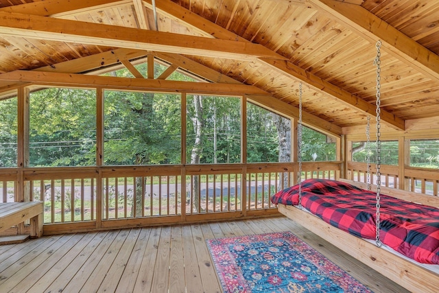 bedroom with vaulted ceiling with beams, wood ceiling, and hardwood / wood-style flooring