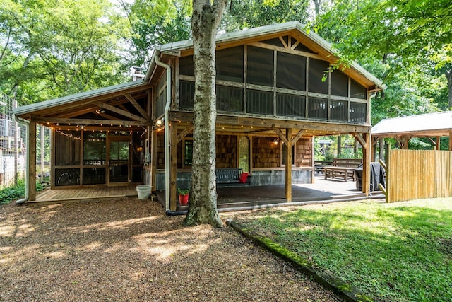 exterior space with a patio area and a sunroom