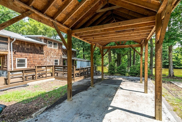 view of patio featuring driveway and a deck