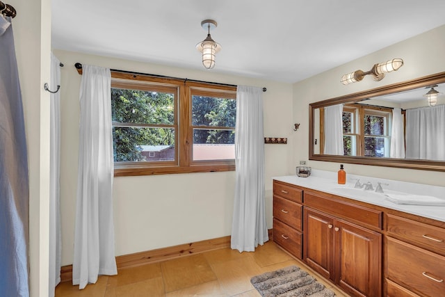 bathroom featuring vanity and baseboards