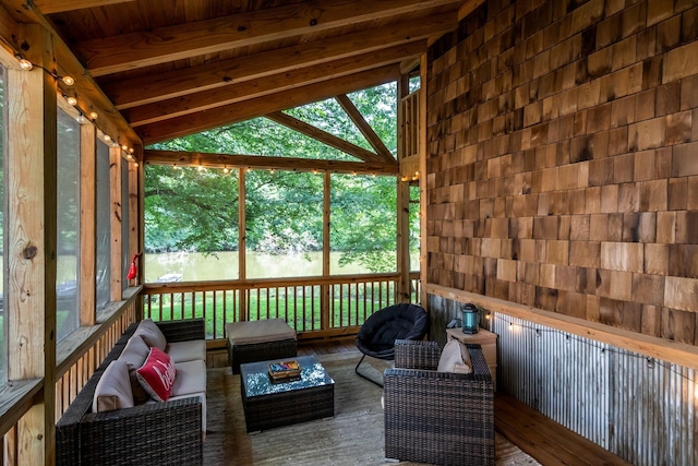 unfurnished sunroom with wood ceiling and lofted ceiling with beams