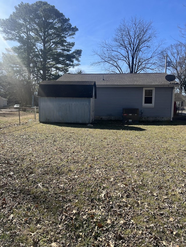 view of property exterior with cooling unit and fence