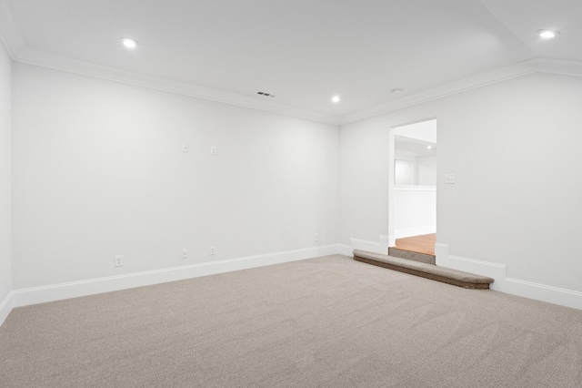 carpeted empty room featuring visible vents, baseboards, lofted ceiling, crown molding, and recessed lighting