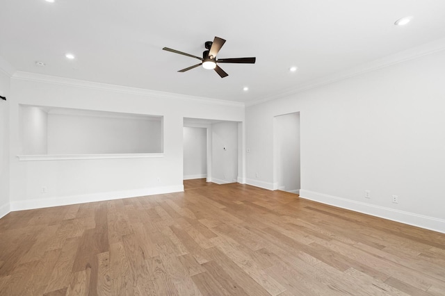 interior space with baseboards, ceiling fan, crown molding, light wood-type flooring, and recessed lighting