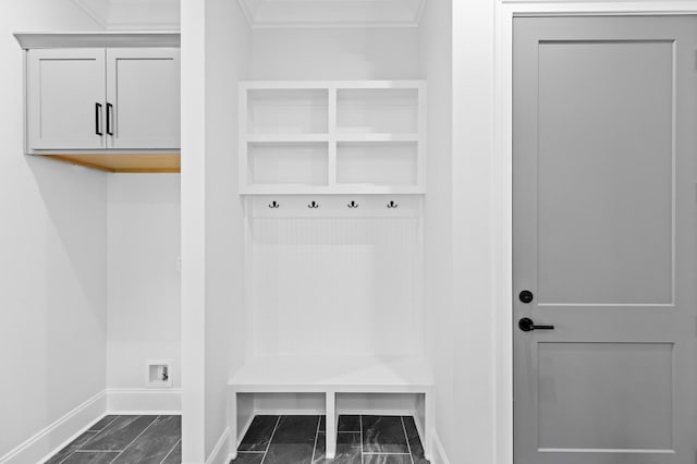 mudroom with crown molding and baseboards