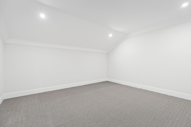 bonus room featuring vaulted ceiling, carpet floors, and baseboards