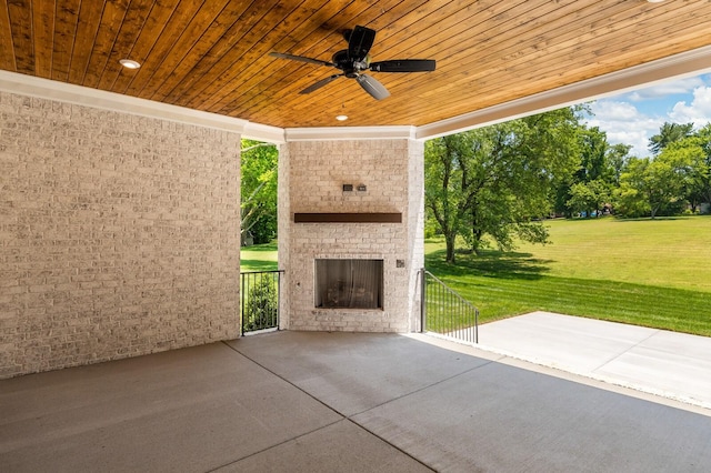 view of patio with ceiling fan and an outdoor brick fireplace