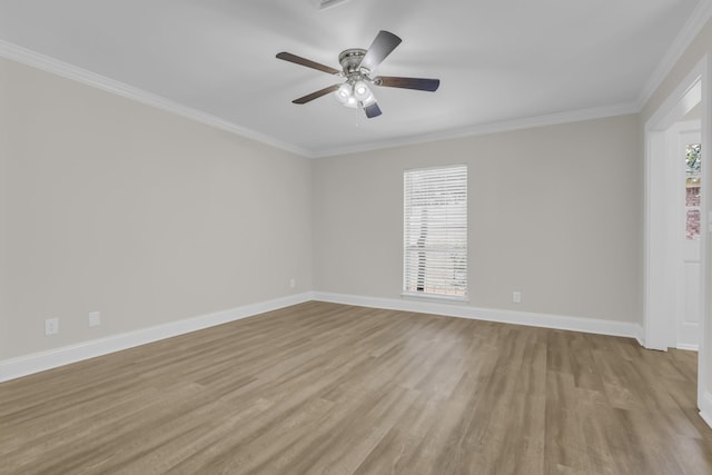 unfurnished room featuring ornamental molding, light wood-type flooring, a ceiling fan, and baseboards