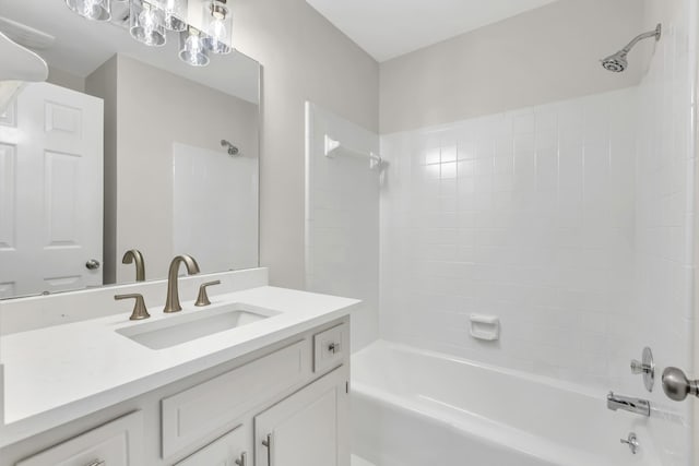 bathroom with vanity and bathing tub / shower combination