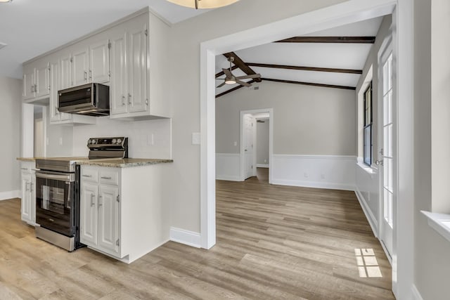 kitchen featuring light wood finished floors, white cabinetry, and appliances with stainless steel finishes