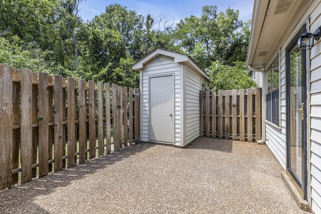 view of shed featuring a fenced backyard