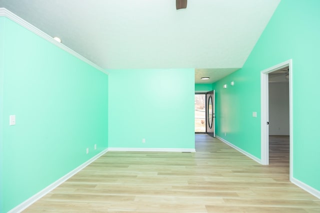 unfurnished room featuring light wood-style flooring and baseboards