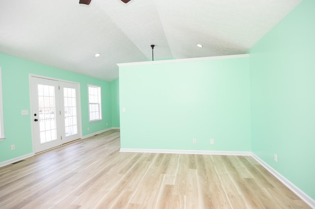 unfurnished room with light wood finished floors, baseboards, ceiling fan, vaulted ceiling, and recessed lighting