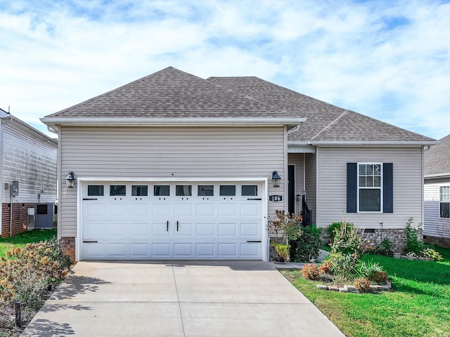 ranch-style home with driveway, a garage, a shingled roof, crawl space, and central AC