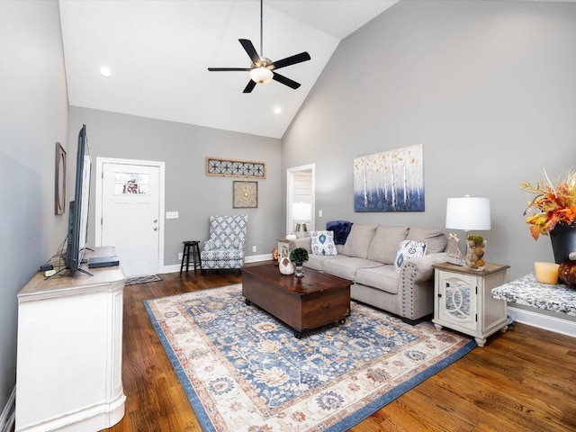 living area with high vaulted ceiling, recessed lighting, dark wood-style flooring, a ceiling fan, and baseboards