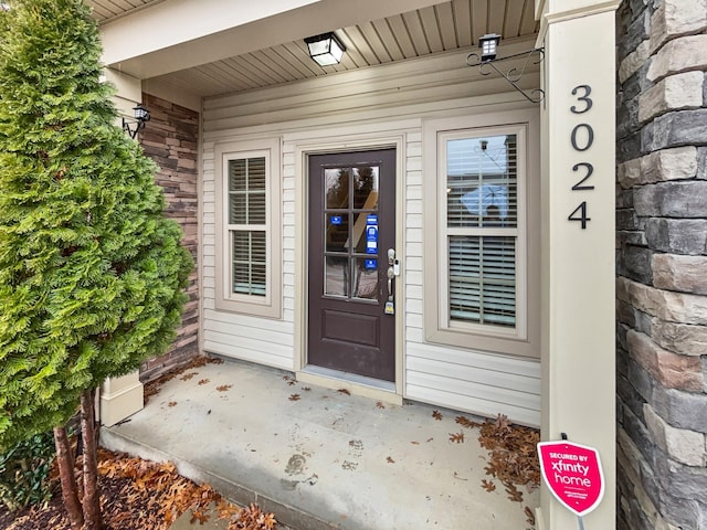 entrance to property with brick siding