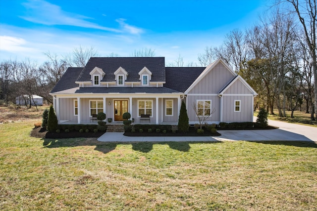 view of front of property with a porch, board and batten siding, and a front yard