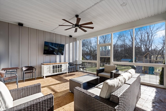 sunroom featuring a healthy amount of sunlight and ceiling fan