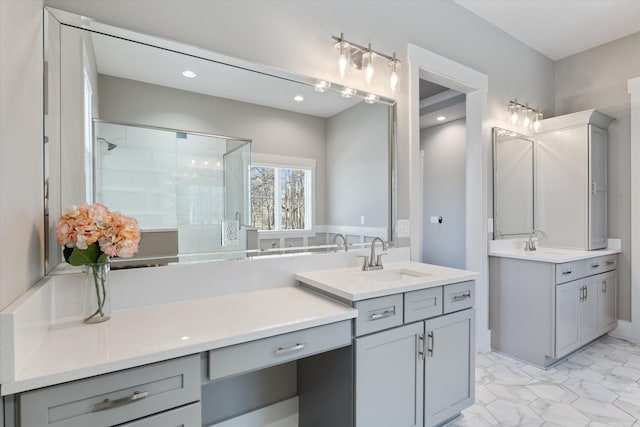 full bath featuring recessed lighting, two vanities, a sink, and a shower stall