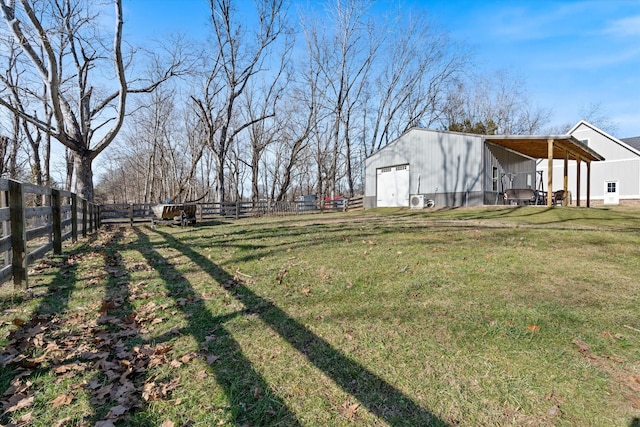 view of yard featuring a fenced backyard, an outbuilding, a carport, and an outdoor structure