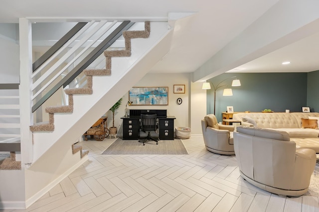 living area with stairway and baseboards