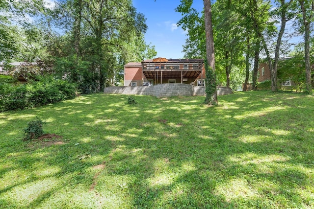 view of yard with a wooden deck