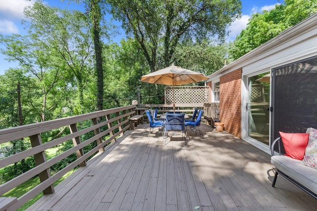 deck featuring outdoor dining area