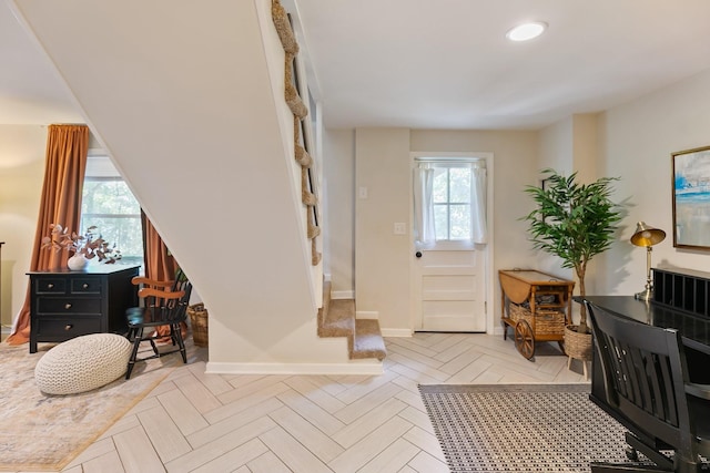 entryway with baseboards and recessed lighting