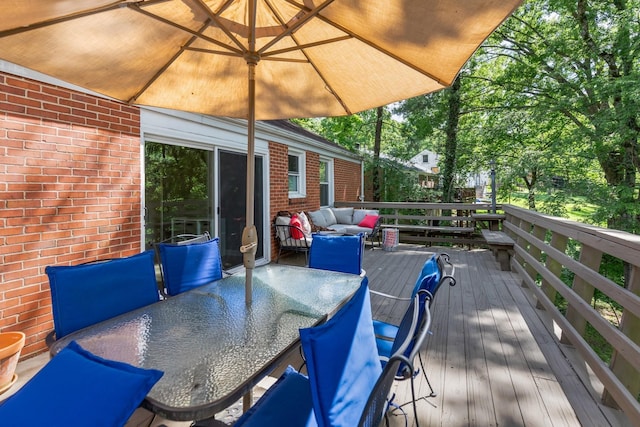 deck featuring outdoor dining area