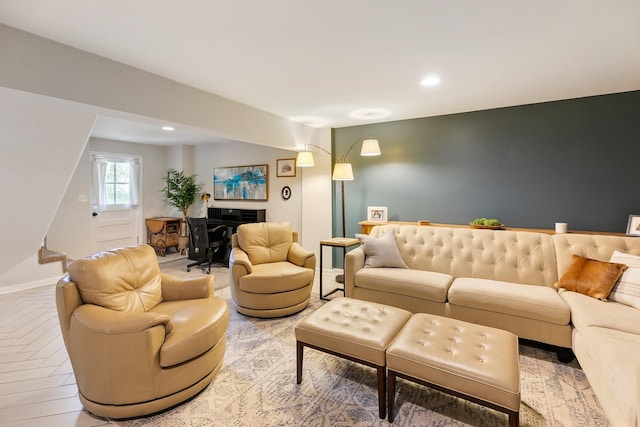 living room featuring baseboards and recessed lighting