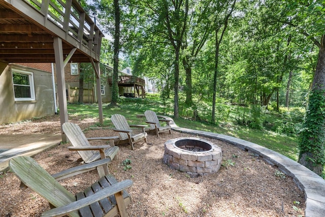 view of patio / terrace with an outdoor fire pit and a wooden deck