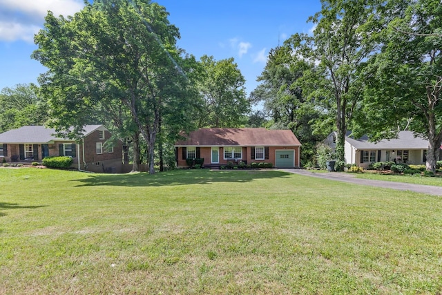 ranch-style home featuring a garage, brick siding, driveway, and a front lawn