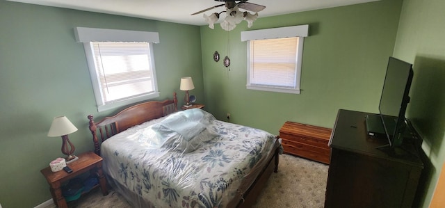 bedroom featuring a ceiling fan and carpet