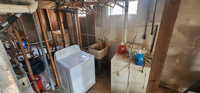 interior space with washing machine and dryer and a sink