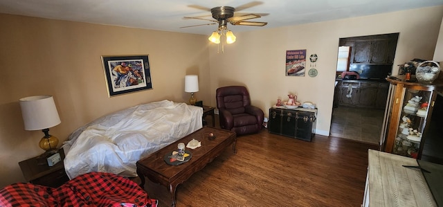 bedroom with ceiling fan and wood finished floors