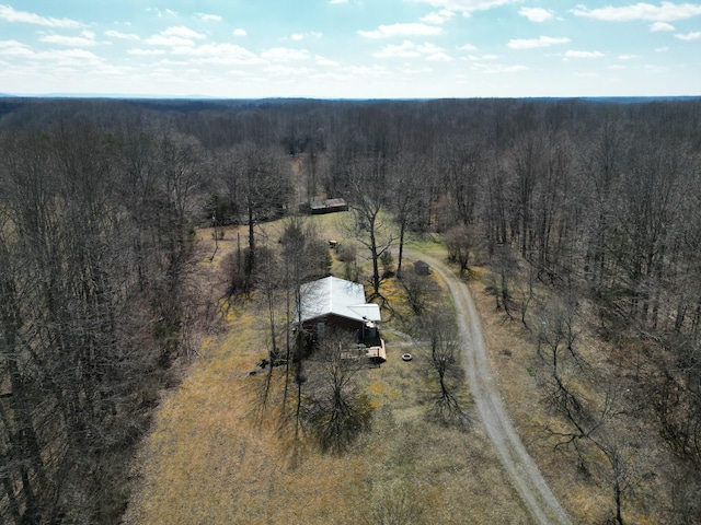 birds eye view of property with a rural view and a view of trees