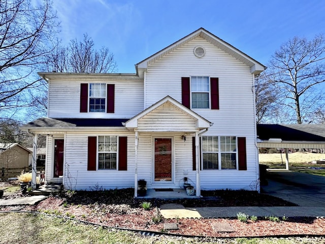 traditional home with a carport and entry steps