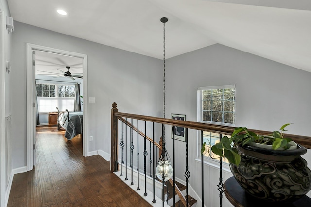 corridor featuring recessed lighting, dark wood-style flooring, an upstairs landing, baseboards, and vaulted ceiling