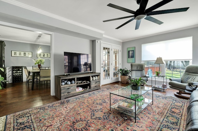 living room with ornamental molding, french doors, and wood finished floors