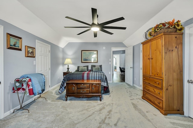 bedroom featuring light carpet, vaulted ceiling, and baseboards